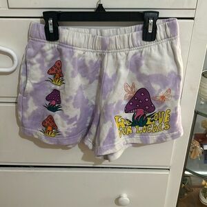 Purple and white tie die mushroom shorts.